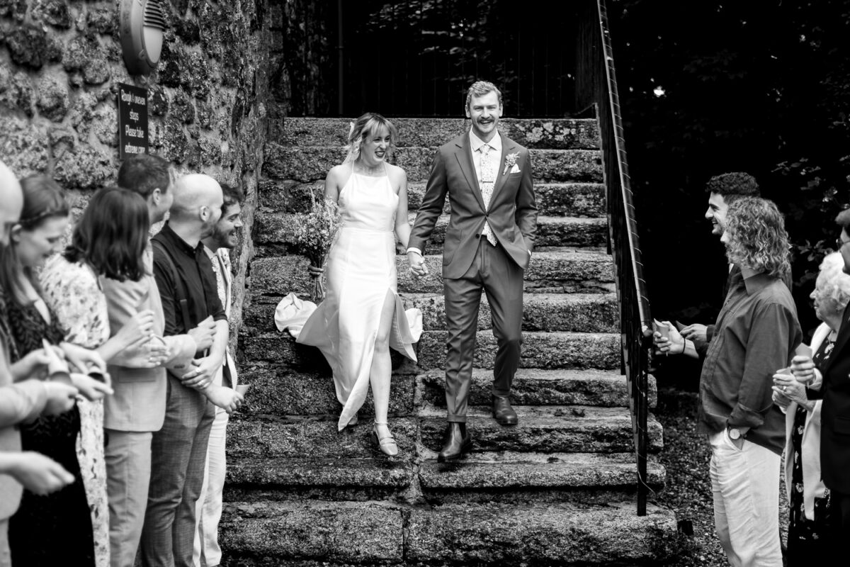 Couple walking down stone steps at knightor winery