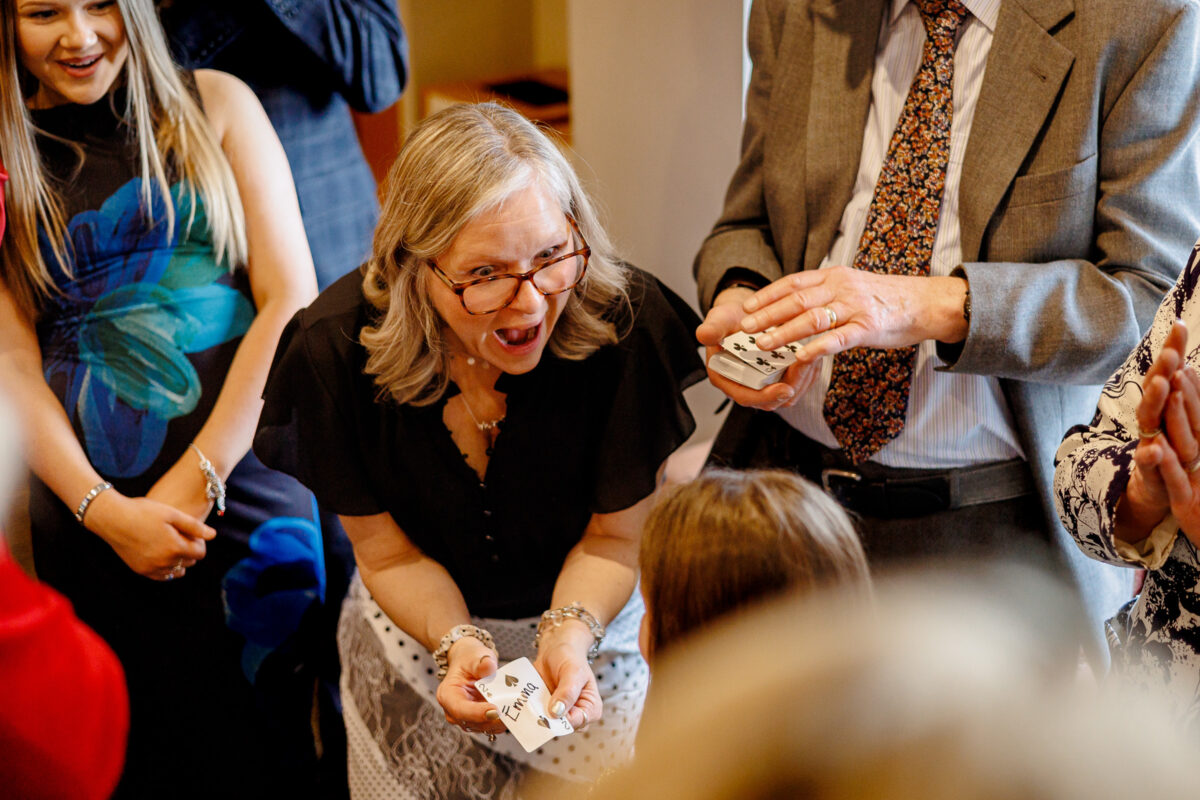 A wedding guest amazed by the magician at Steff and Jan's wedding