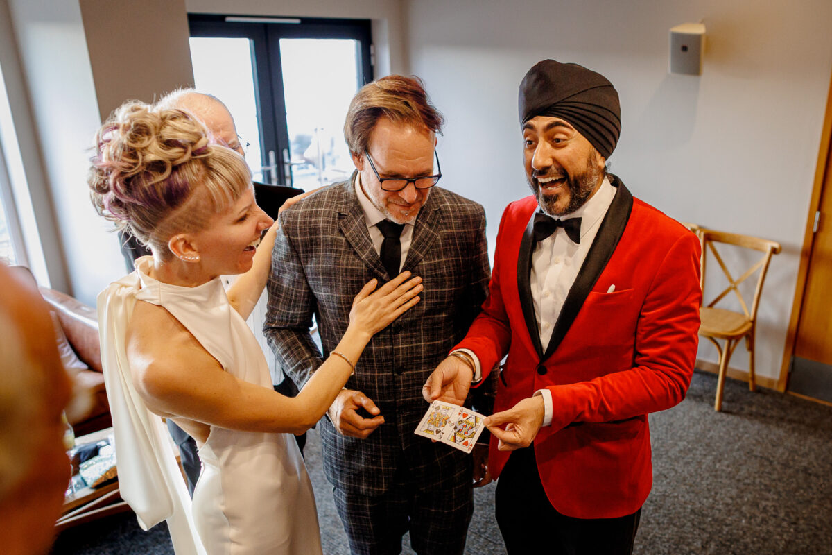 Steff & Jan with their magician - Magic Singh at their bedruthan steps wedding