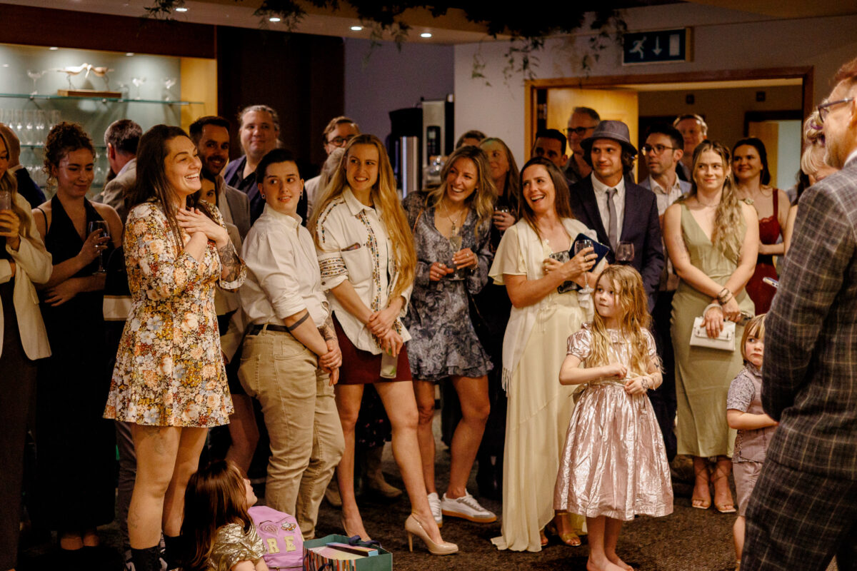 Guests listening to speeches during Steff and Jan's wedding