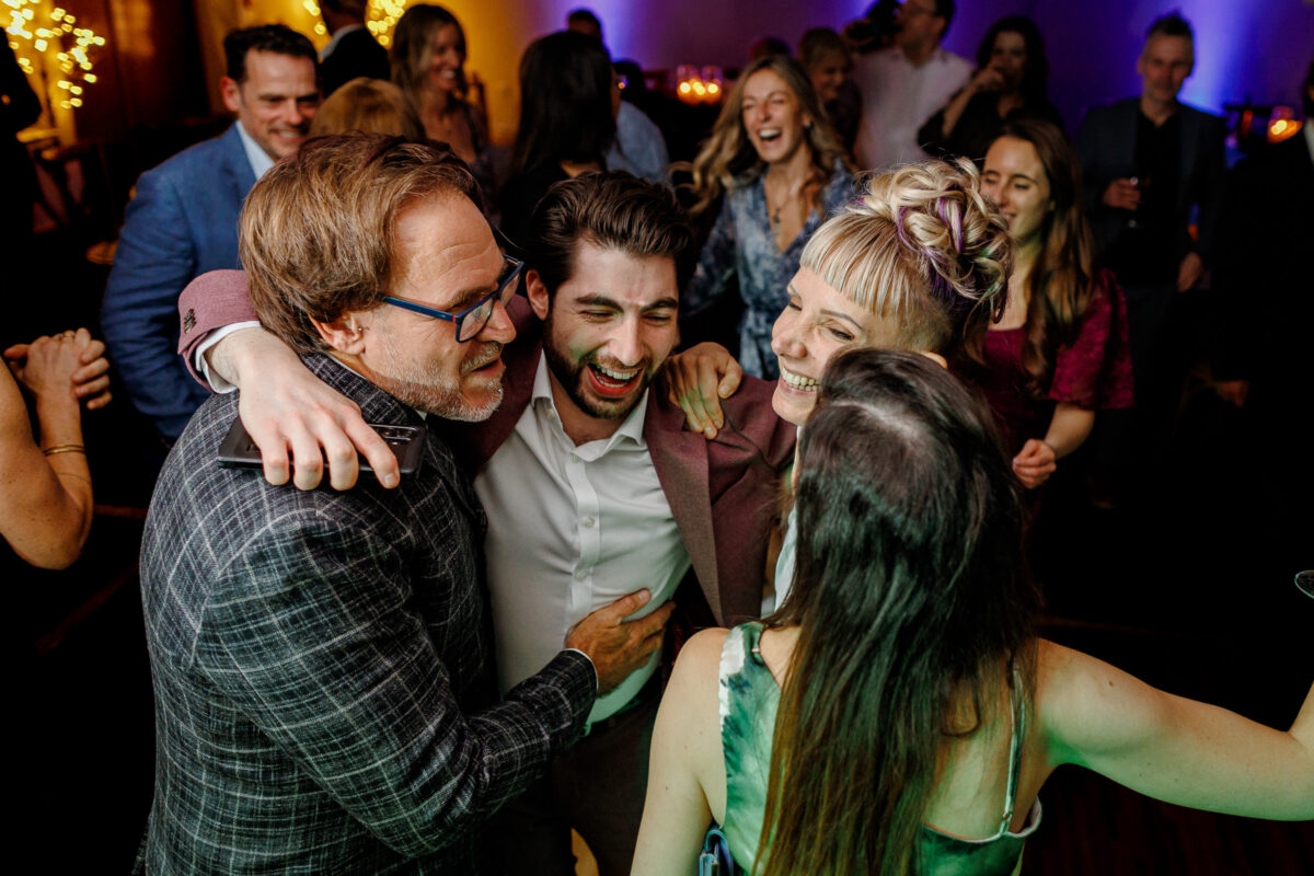 Steff and Jan's guests dancing to the band during their evening wedding reception