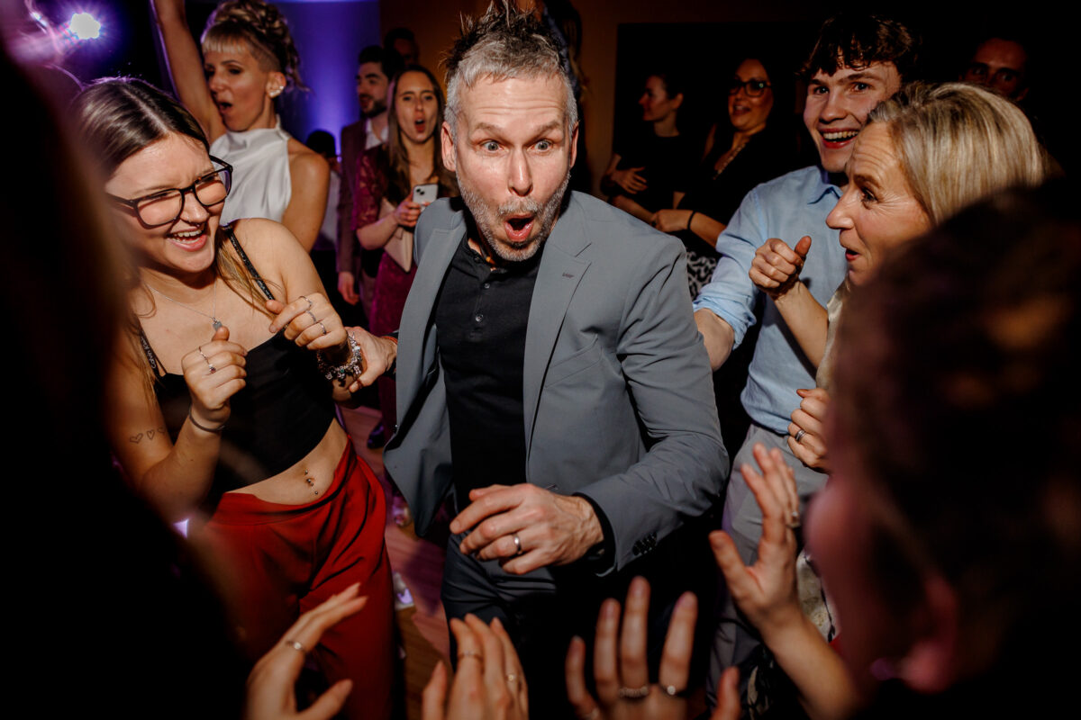 Steff and Jan's guests moshing to the band during their evening wedding reception