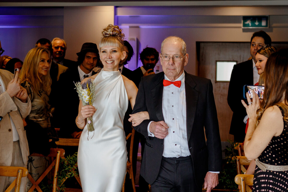 Steff and her Dad walking down the aisle at her Bedruthan Steps Wedding