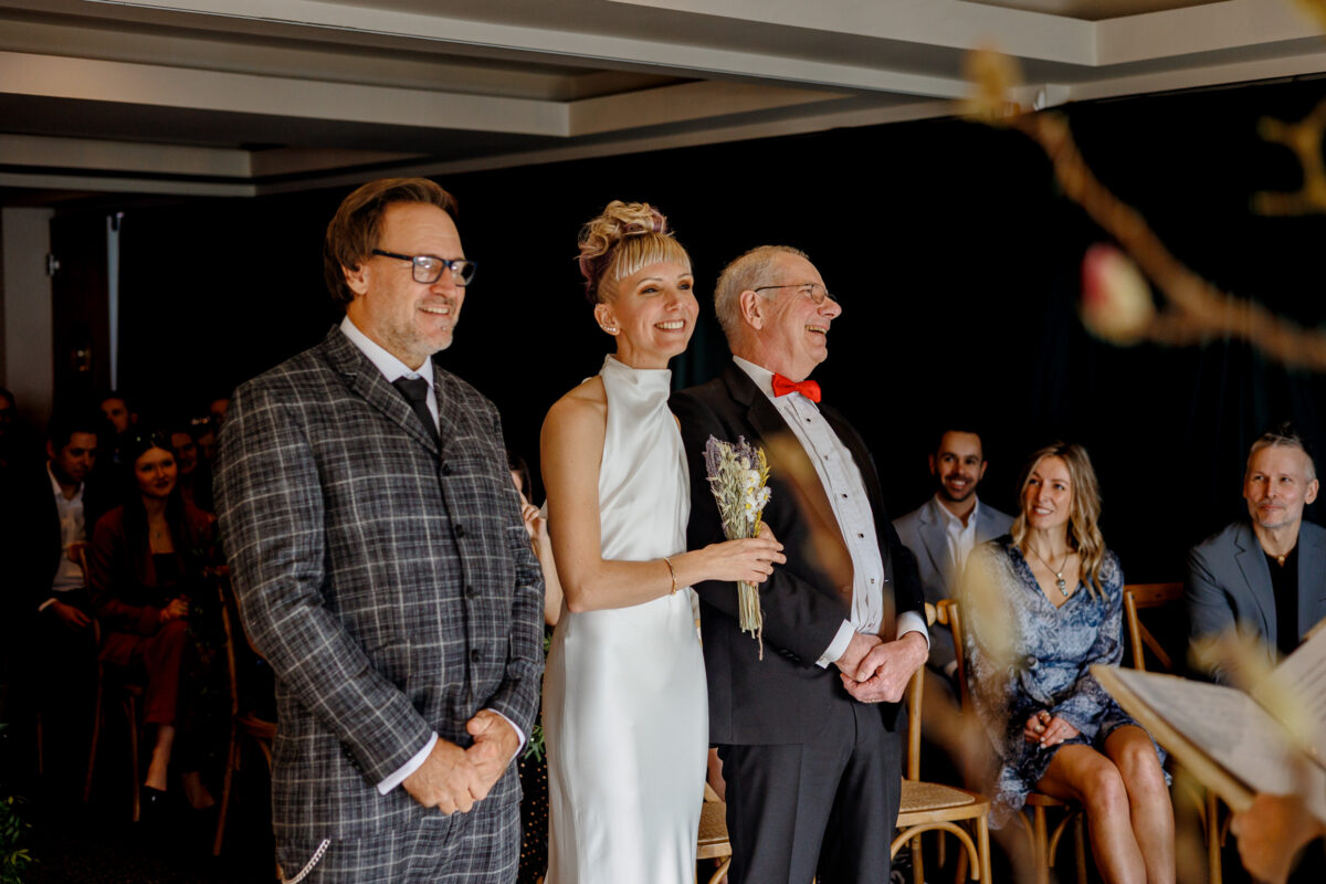 Steff, Jan and her Dad at their ceremony during their February wedding at Bedruthan Steps Hotel