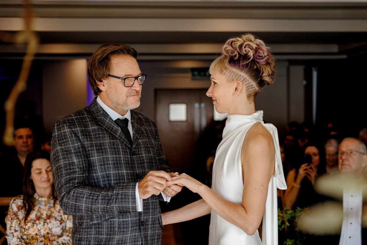 Steff and Jan exchanging vows during their February wedding at Bedruthan Steps Hotel