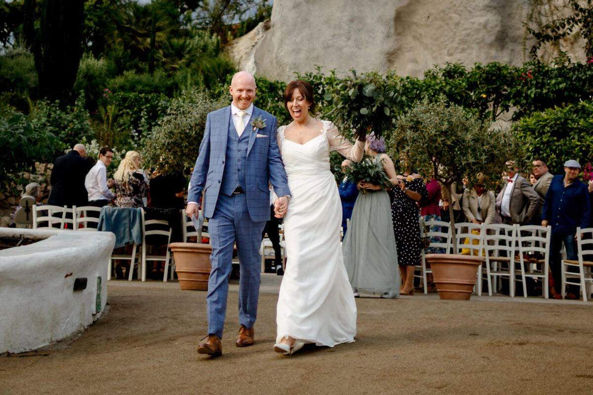 Cheryl and Chris walking out from their wedding ceremony