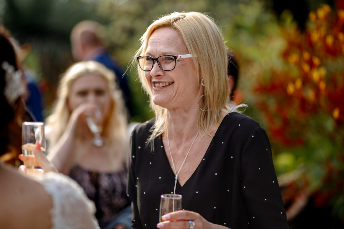 Wedding guest laughing during Cheryl and Chris's wedding