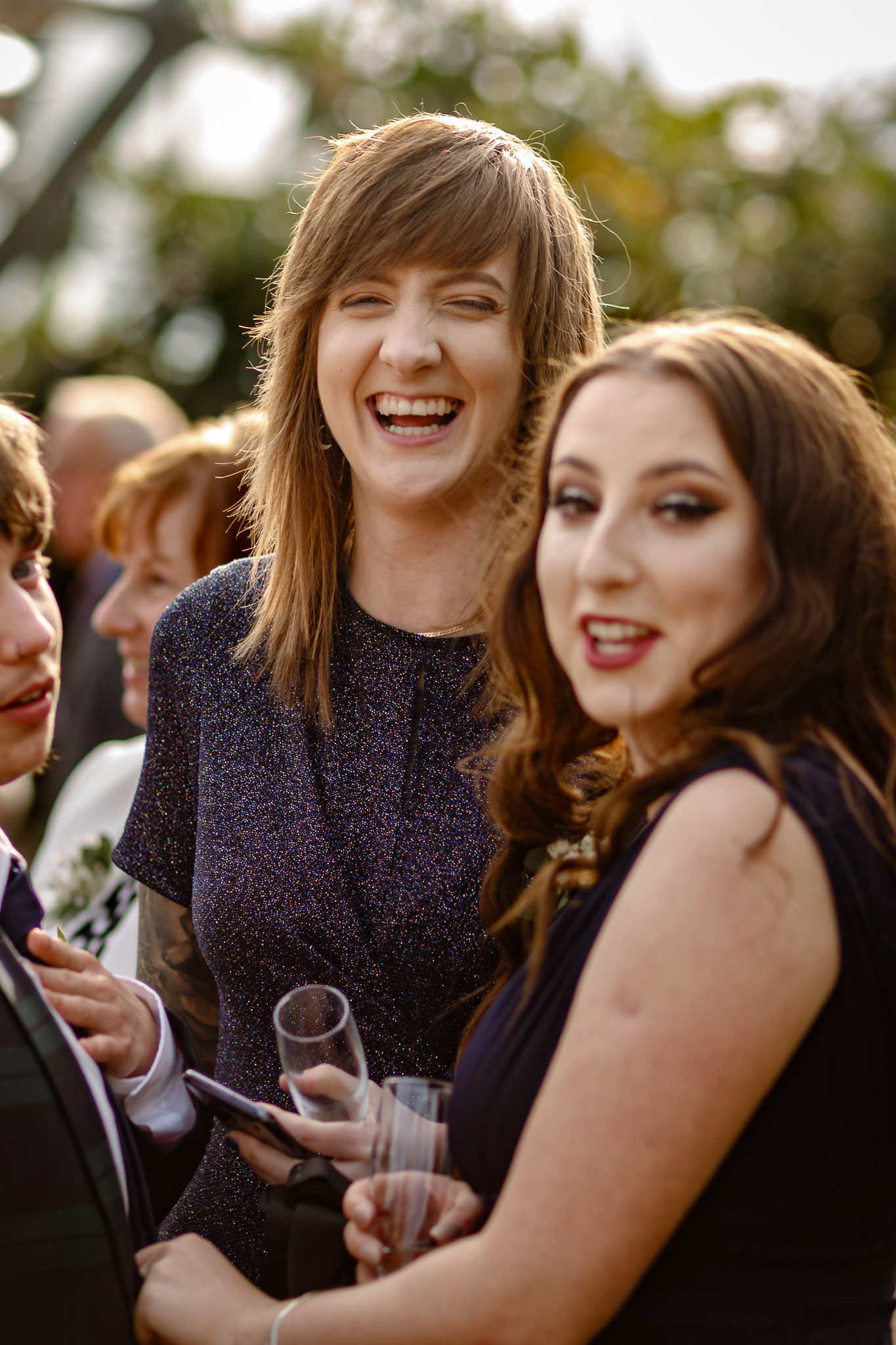 eedding guests smiling together at the Eden Project