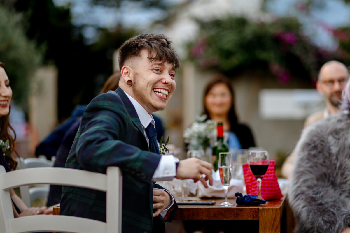 Wedding guest smiling during the reception