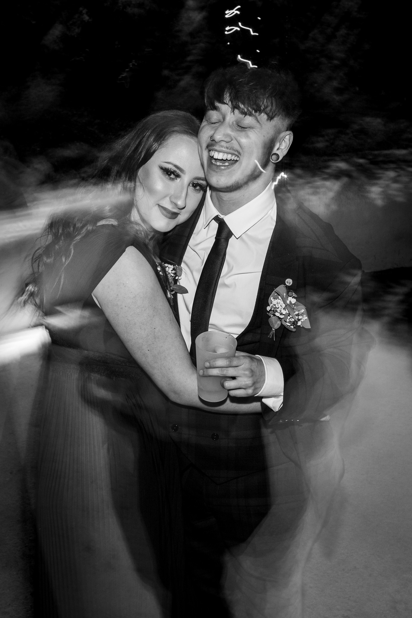 Black and white photograph of a couple dancing at a wedding