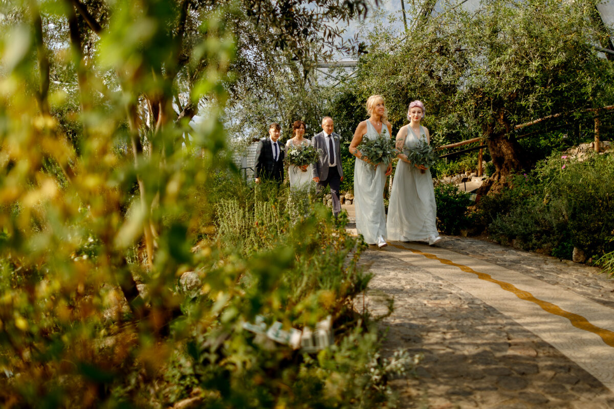 Cheryl and her bridal party walking through the gardens at the Eden Project