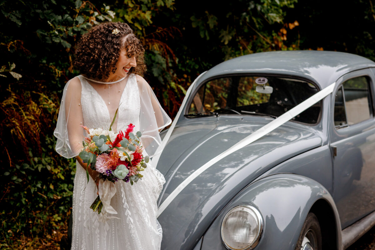 a bride with her wedding car