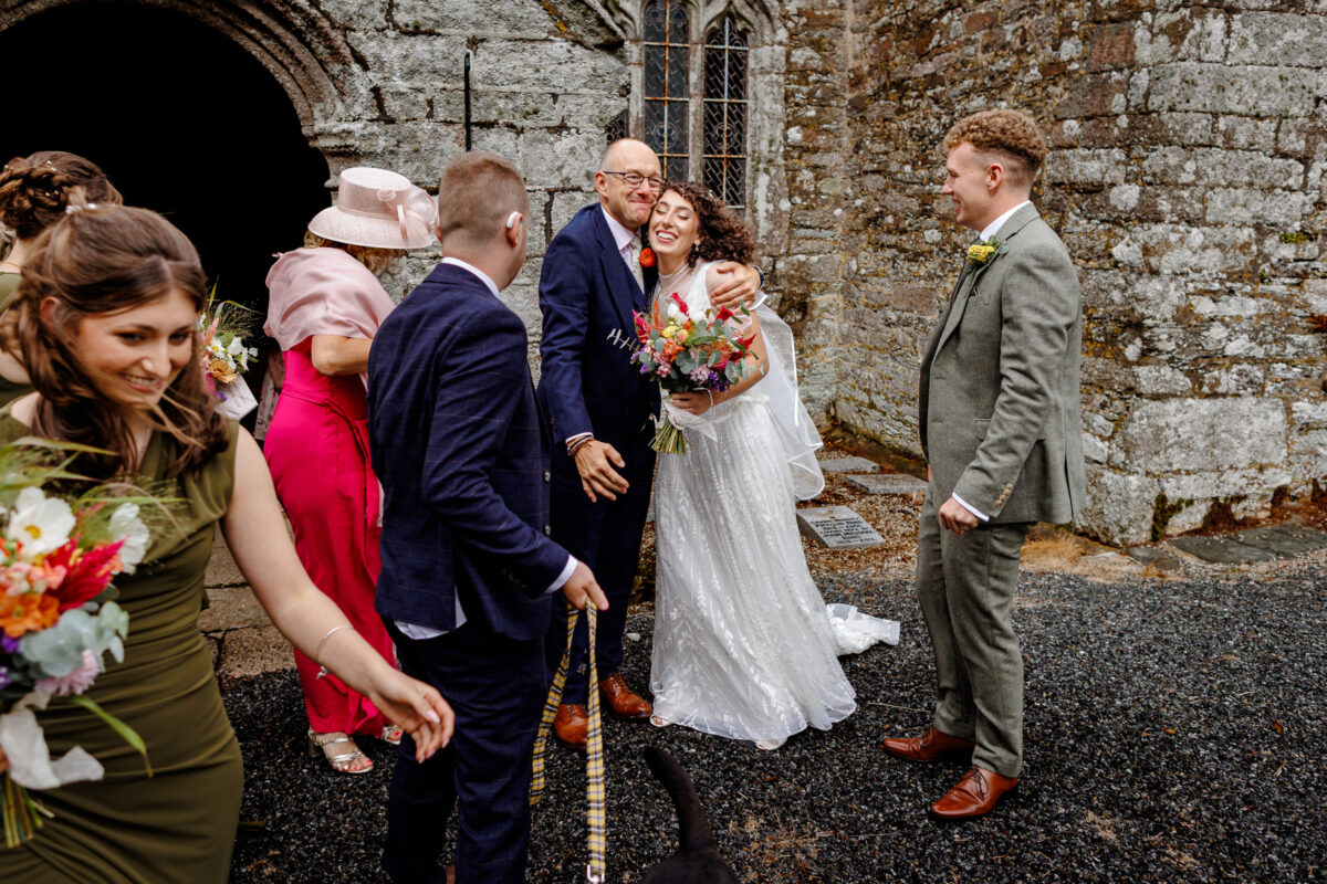 a cornish bride being congratulated by guests